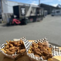 Poor Betty’s - Halibut Basket with half a pound of local
Halibut breaded and deep fried with Cajun seasoned fries and tartar sauce