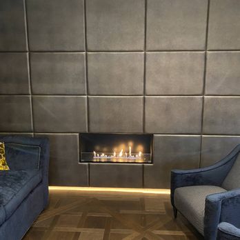 Hide and Stitch - Gold embossed leather panels made to fit around fire in central London property. - Furniture Stores Near Me - Isleham, CAM