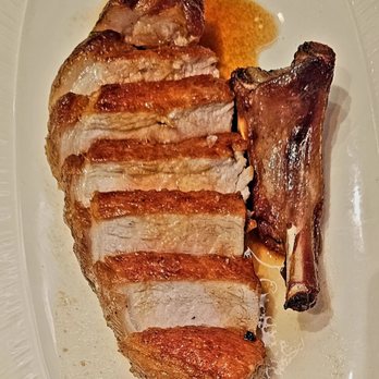 Cino - ,14 day, dry aged pork chop. Juicey on the inside and crispy on the outside. - Italian Near Me - Honolulu, Hawaii Cino - ,14 day, dry aged pork chop. Juicey on the inside and crispy on the outside. - Italian Near Me - Honolulu, Hawaii