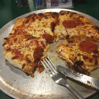 Moondance - a slice of pepperoni pizza with a fork and knife - Pizza Near Me - Marcellus, New York