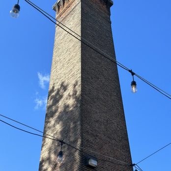Dive Bar & Grille - The old mill smoke stack out on the patio - Breakfast & Brunch Near Me - Savage, Maryland