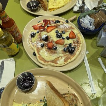 Snooze, an A.M. Eatery - Omelette split in half to share & dulce de leche pancake of the week - Breakfast & Brunch Near Me - Tustin, California