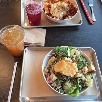 CoreLife Eatery - A delicious Chicken Ceaser bowl with Apple Cider Green Tea (below) and a vibrant Pork Bowl with Beet Lemonade (above). - Salad Near Me - Indianapolis, Indiana