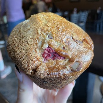 Love Muffin Cafe - a hand holding a muffin - Coffee & Tea Near Me - Moab, Utah
