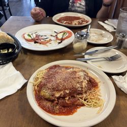 Angelos Italian Restaurant - From bottom to top: chicken Parmesan, capri salad, manicotti
