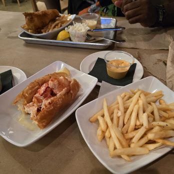 Hazel's - Bottom: Warm butter lobster roll and fries.  Top: Fish and chips - Bars Near Me - Birmingham, Michigan