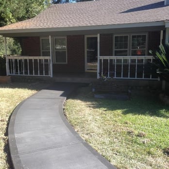 Larry Pichotta Construction & Roofing - a walkway leading to a house - Roofing Near Me Larry Pichotta Construction & Roofing - a walkway leading to a house - Roofing Near Me