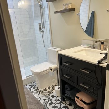 J Herrera Construction - a bathroom with a sink, toilet, and shower - General Contractors Near Me - Nipomo, California J Herrera Construction - a bathroom with a sink, toilet, and shower - General Contractors Near Me - Nipomo, California