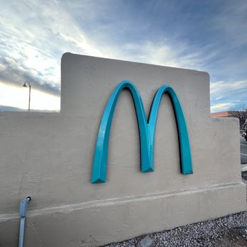McDonald's - a blue mcdonald's logo on the side of a building - Fast Food Near Me - Sedona, Arizona