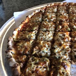 Sammy Perrella's Pizza & Restaurant - We were so hungry started eating right away. This is hamburger green olive pizza