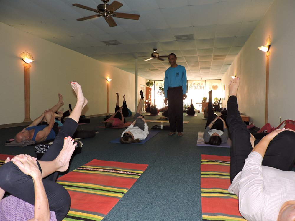 Rising Hearts Yoga Studio Logo