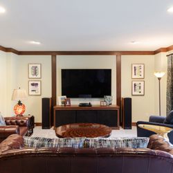 Timeless Craftsman home transformed with jewel tones, custom details, and refined materials for elegant, comfortable living.