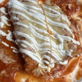 La Reyna - Authentic Mexican Cuisine - Red Enchiladas (Filled with only chicken) - Mexican Near Me - Cooper City, Florida La Reyna - Authentic Mexican Cuisine - Red Enchiladas (Filled with only chicken) - Mexican Near Me - Cooper City, Florida