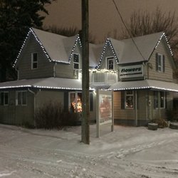Welcome Home Flower and Gift Boutique - The century old storefront that is home to our flower and gift shop on a frosty winter night