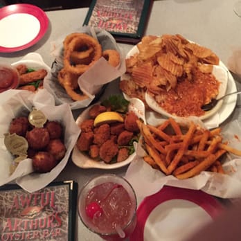 Awful Arthur's Oyster Bar - The apps: cajun fries, awesome crab dip, bad barracuda bites, onion rings, basket of pups, mozz sticks - Seafood Near Me - Kill Devil Hills, North Carolina Awful Arthur's Oyster Bar - The apps: cajun fries, awesome crab dip, bad barracuda bites, onion rings, basket of pups, mozz sticks - Seafood Near Me - Kill Devil Hills, North Carolina