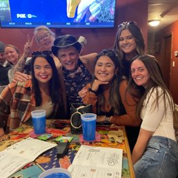 a group of people sitting around a table