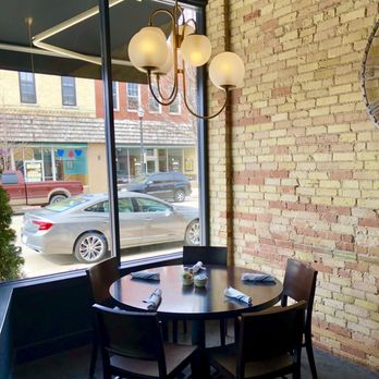 Inn At Cedar Crossing - a table and chairs in front of a window - American Near Me - Sturgeon Bay, Wisconsin Inn At Cedar Crossing - a table and chairs in front of a window - American Near Me - Sturgeon Bay, Wisconsin