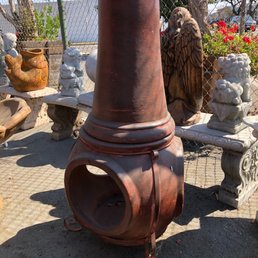 clay chiminea with iron stand