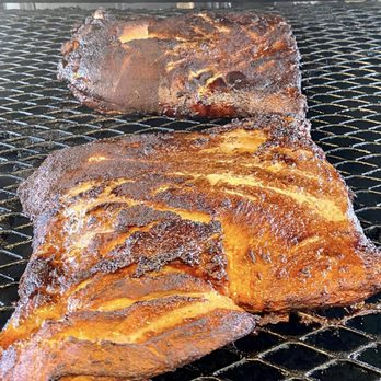 Stusquatch's Rockstar BBQ - two pieces of meat on a grill - Barbeque Near Me - Springfield, Missouri Stusquatch's Rockstar BBQ - two pieces of meat on a grill - Barbeque Near Me - Springfield, Missouri