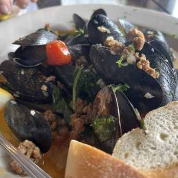 Oyster Creek Inn - P.E.I. Mussels in white wine with chorizo tomatoes spinach - Seafood Near Me - Leeds Point, New Jersey Oyster Creek Inn - P.E.I. Mussels in white wine with chorizo tomatoes spinach - Seafood Near Me - Leeds Point, New Jersey