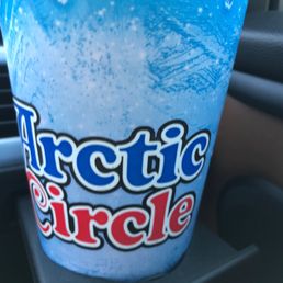 a blue drink in a plastic cup