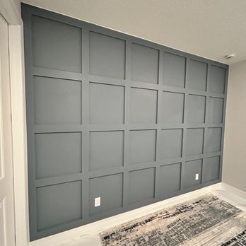Daniel Wall Arts - Accent wall in the master bedroom, with a square design in blue. This wall sits behind the double bed, adding a modern and elegant touch to - Carpenters Near Me Daniel Wall Arts - Accent wall in the master bedroom, with a square design in blue. This wall sits behind the double bed, adding a modern and elegant touch to - Carpenters Near Me