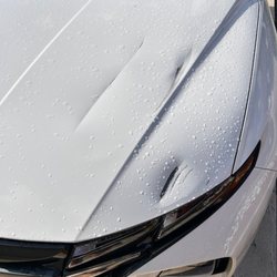 Gunslinger Refinishing - A gate came down on this one! Bodyshop wanted an expensive hood from the dealer!