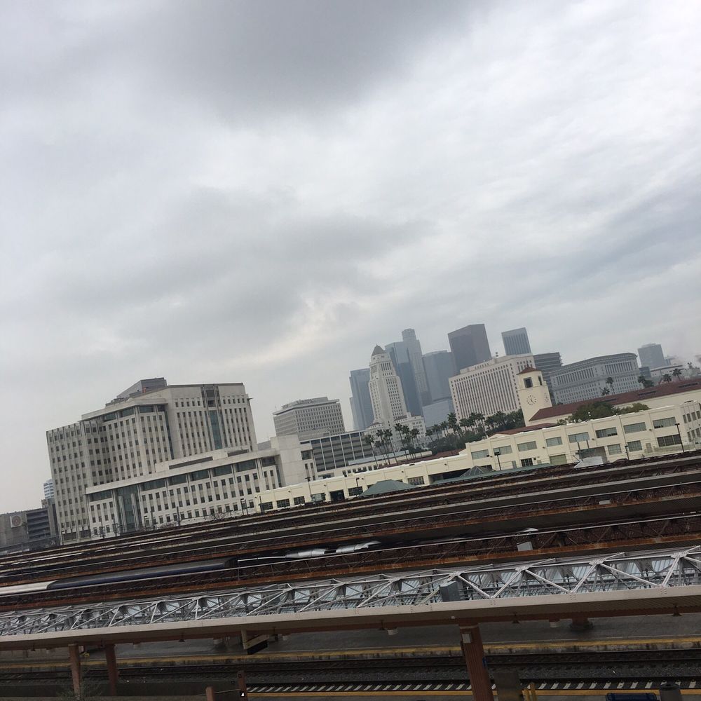 a view of a city from a train station a view of a city from a train station