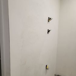 Zuleey Handyman Services - Same bathroom wall after the joint compound applied.