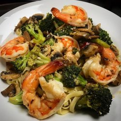 Route 1 Grill House - Delicious Jumbo Shrimp sautéed with broccoli and mushrooms in a garlic white wine sauce, tossed over linguini