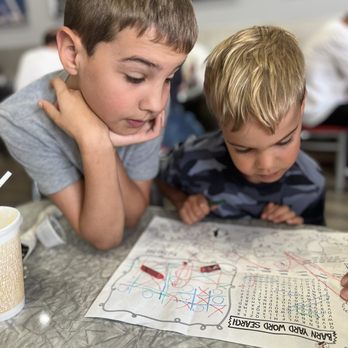 Delaney’s Diner - Sylvester and Rodger doing the word search - American Near Me - Columbus, Ohio