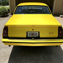 Jack Wraps - 1984 Monte Carlo SS wrapped in gloss yellow with custom red stripes and decals