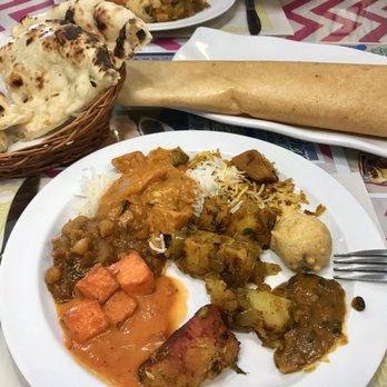 Desi Kitchen - Two types of bread (dosa style on the right) were provided with the Saturday buffet. The food was AMAZING! - Indian Near Me - Houston, Texas Desi Kitchen - Two types of bread (dosa style on the right) were provided with the Saturday buffet. The food was AMAZING! - Indian Near Me - Houston, Texas