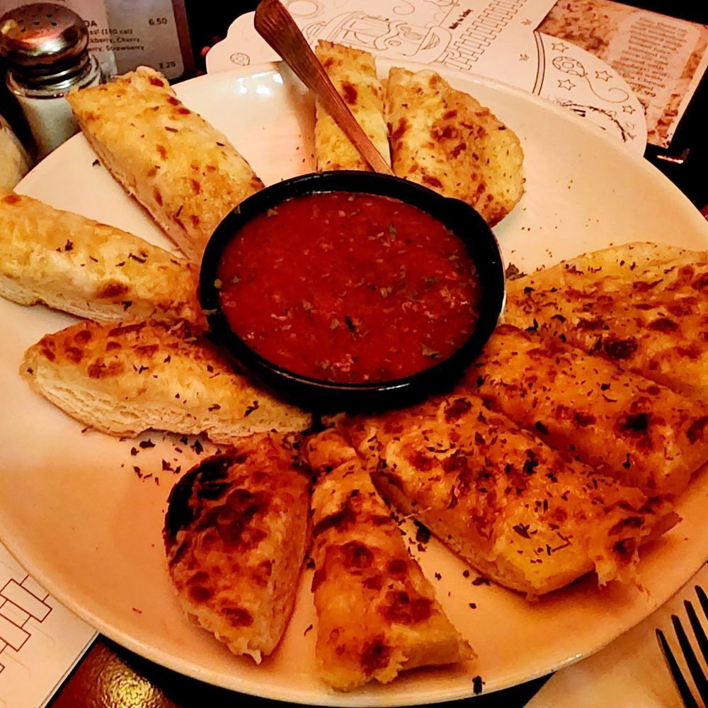 The Old Spaghetti Factory - Sicilian Garlic Cheese Bread. $9.50. - Italian Near Me - Fullerton, California The Old Spaghetti Factory - Sicilian Garlic Cheese Bread. $9.50. - Italian Near Me - Fullerton, California