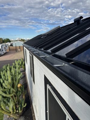 Installed new 6 inch black gutters - Customer wanted new black gutters to match brand new standing seam roof. New 6 inch black gutters installed and downspouts. Customer was satisfied and thought it looked fantastic.. Definitely complemented standing team roof. Installed new 6 inch black gutters - Customer wanted new black gutters to match brand new standing seam roof. New 6 inch black gutters installed and downspouts. Customer was satisfied and thought it looked fantastic.. Definitely complemented standing team roof.