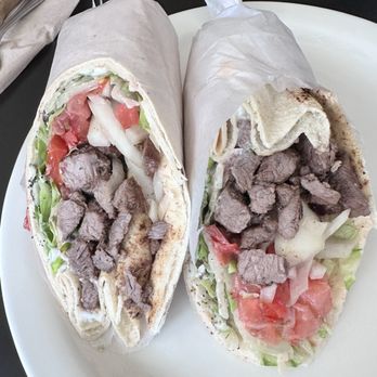 Fast Eddy's Quick Mideast - Beef Eddy | specially seasoned grilled steak wrapped in a pita with lettuce, tomato, pickle & onion. Choose Taziki, Tahini, Garlic or Amba - Middle Eastern Near Me - Jacksonville, Florida