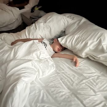 SpringHill Suites by Marriott San Jose Fremont - Kid sleeping in one of the two king sized beds. - Hotels Near Me - Fremont, California SpringHill Suites by Marriott San Jose Fremont - Kid sleeping in one of the two king sized beds. - Hotels Near Me - Fremont, California