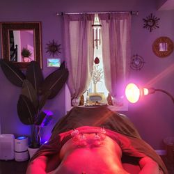 Manifest Station DC - Cupping Therapy combined with infrared red light therapy during the Intuitive Combination Massage & Bodywork session.