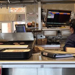Habit Burger & Grill - Those burgers on the grill are ours the one next to the grill is the stock pile.