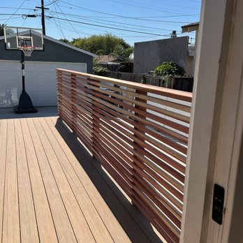 Tgibbs Construction - Beautiful long boards spanning the full length of the deck for continuous line of sight, creating a "vanishing" effect - General Contractors Near Me