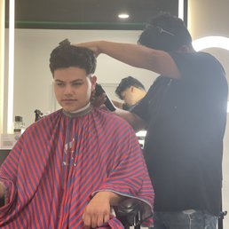 Little brother getting his cut