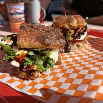 Woodneck Kitchen - Poor Joe sandwich- chicken cutlet with Calabrian chile romesco, on focaccia - Barbeque Near Me - Austin, Texas