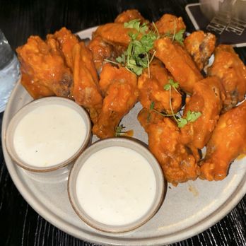 The Wolfe - Cherry Chipotle Chicken Wings (16) tossed in Hot Buffalo Sauce with a side of ranch - American Near Me - New York, New York The Wolfe - Cherry Chipotle Chicken Wings (16) tossed in Hot Buffalo Sauce with a side of ranch - American Near Me - New York, New York