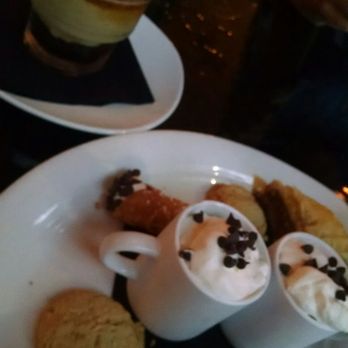 Polizzi's - Trio of dessert the cappuccino mouse was the highlight and the crispy cannoli shell. Boudino on the top was thin - Italian Near Me - Rochester, New York