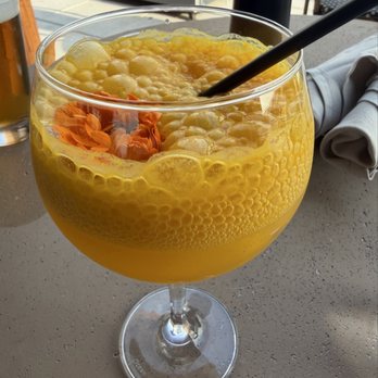 Realm Rooftop Bar & Lounge - Golden hour passion fruit drink - Lounges Near Me - Washington, DC, District of Columbia Realm Rooftop Bar & Lounge - Golden hour passion fruit drink - Lounges Near Me - Washington, DC, District of Columbia