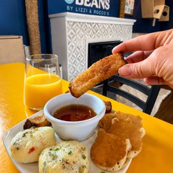 A delicious breakfast and brunch spread served at Bertha's Beans Cat Café, featuring freshly prepared comfort food, warm syru...