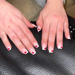 Natural nails with SNS (color unknown, but probably c40) and hand drawn hearts for Valentine's Day. Done by Amy.