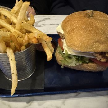 Illusive Restaurant & Bar - Grilled chicken pesto sandwich and truffle fries! - American Near Me - Rensselaer, New York Illusive Restaurant & Bar - Grilled chicken pesto sandwich and truffle fries! - American Near Me - Rensselaer, New York