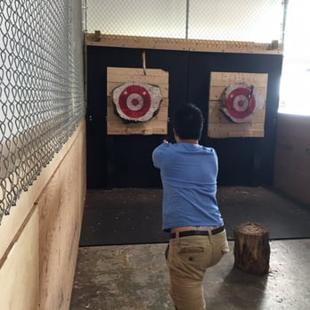 Bullseye Axe Throwing - Friend throwing the axe midair! - Axe Throwing Near Me - Newmarket, Ontario