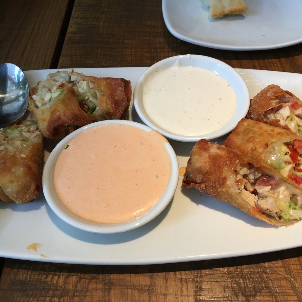 California Pizza Kitchen - Avocado Club Egg Rolls (wontons, avocado, chicken, tomato, Monterey Jack, Nueske’s applewood smoked bacon), ranchero sauce, herb ranch sauce - Pizza Near Me - Annapolis, Maryland